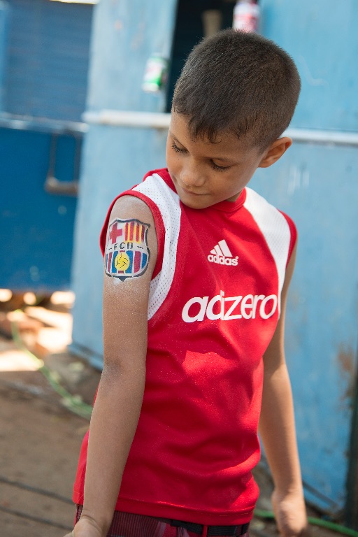 Trinity. Proud of his tattoo ...